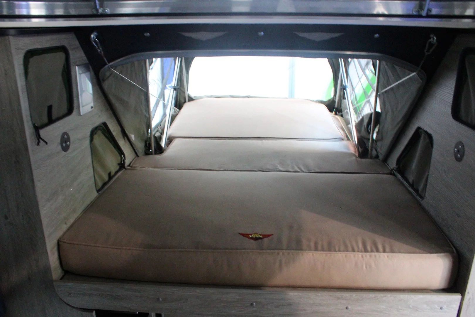 The Xplorer is a rugged four-sleeper with a pop-top and pop-out extension