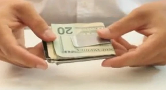 The KeyLet loaded with a stack of money and credit cards