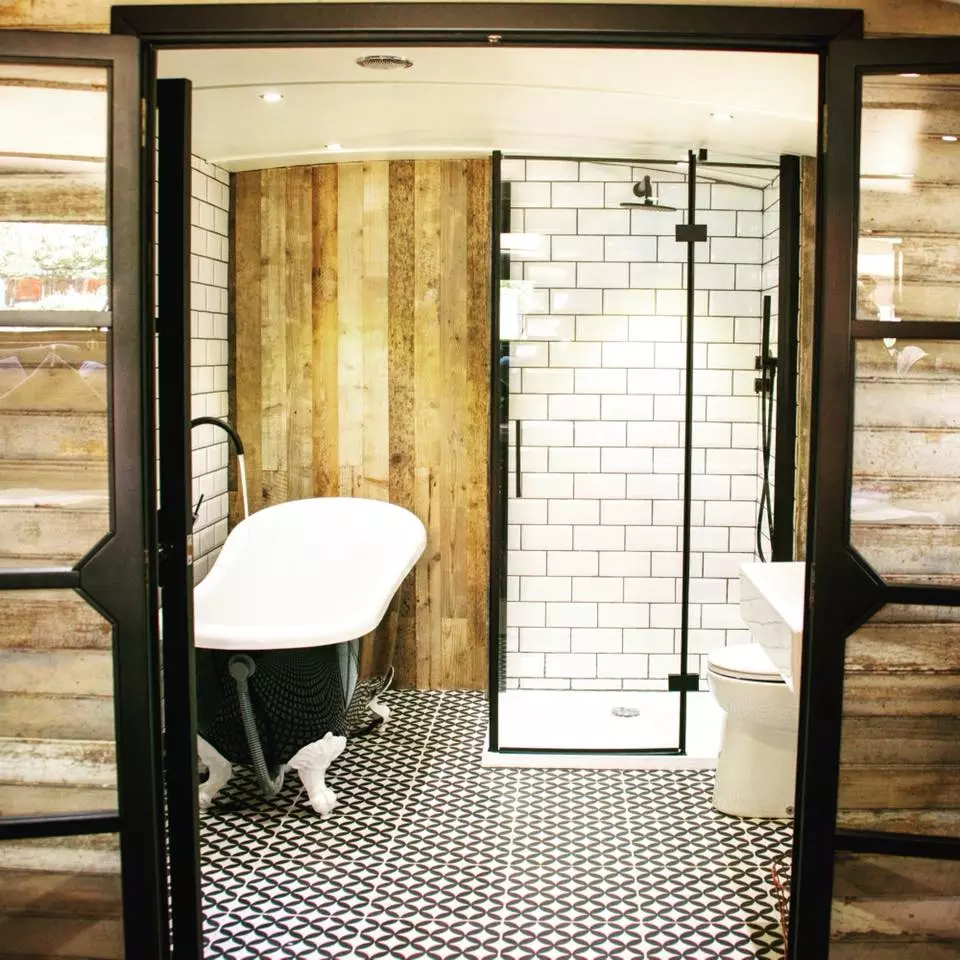 The houseboat features modern tiling throughout the wet zones