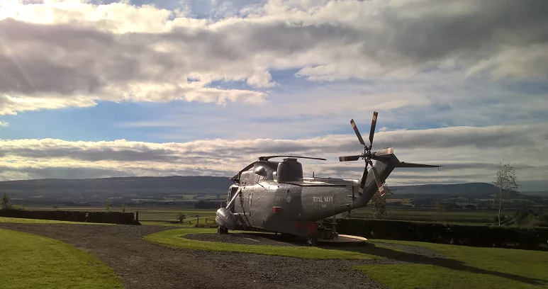 The ex-Royal Navy helicopter was purchased at auction for £7,000 (approx. US $9,100) in March last year, before being transported by road and then craned into its new home on the Mains Farm Wigwams' campsite