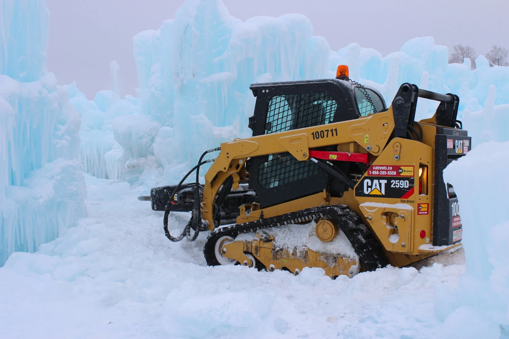A bobcat goes to work on the Edmonton Ice Castle