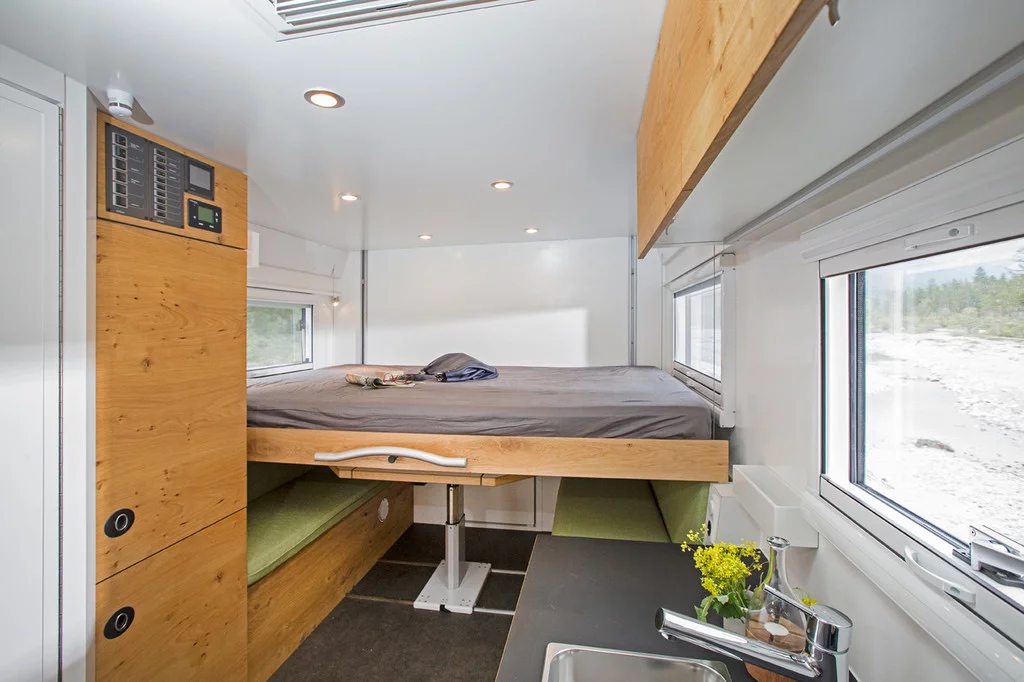 The drop-down bed saves space, lowering over the dinette set when it's time to sleep