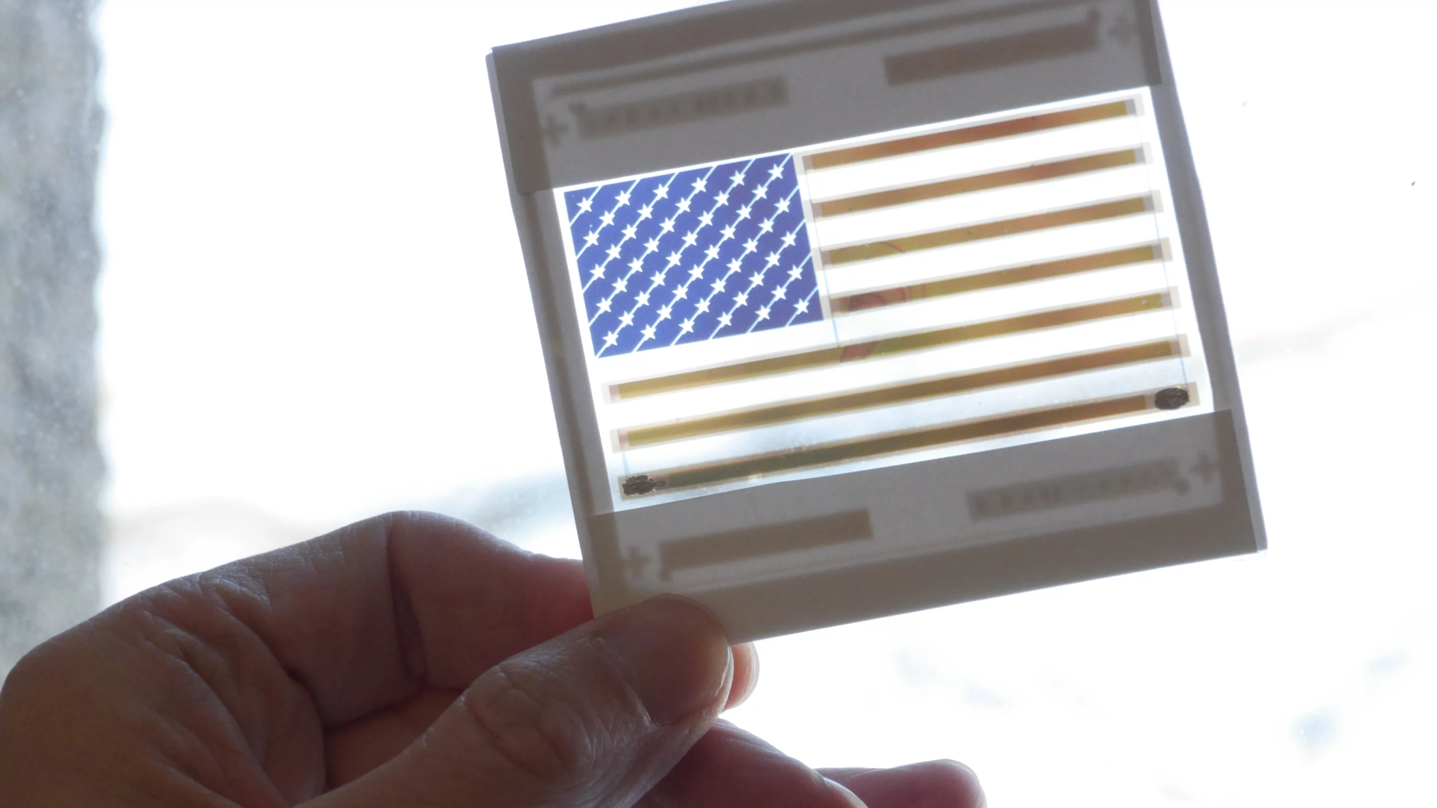 This colorful American flag is in reality a functional and transparent solar cell (Photo: Joseph Xu, Michigan Engineering Communications & Marketing)