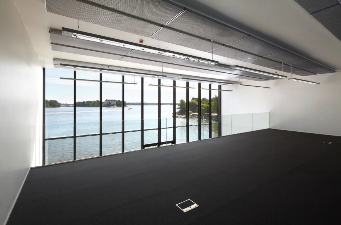 Floor-to-ceiling windows flood the offices with natural light while also taking advantage of the premium waterfront views