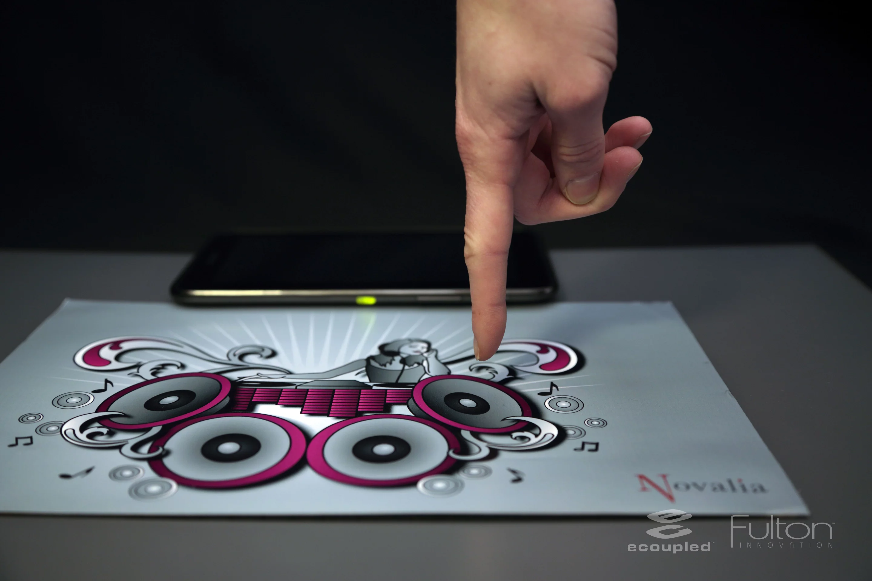 By tapping the speakers, mixer and turntable, users can play music on an interactive printed poster