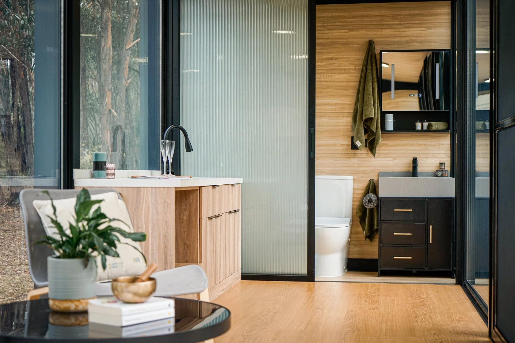 The Beaufort Bushland Retreat's kitchen is small and simple, with a sink and cabinetry, plus space to add some appliances