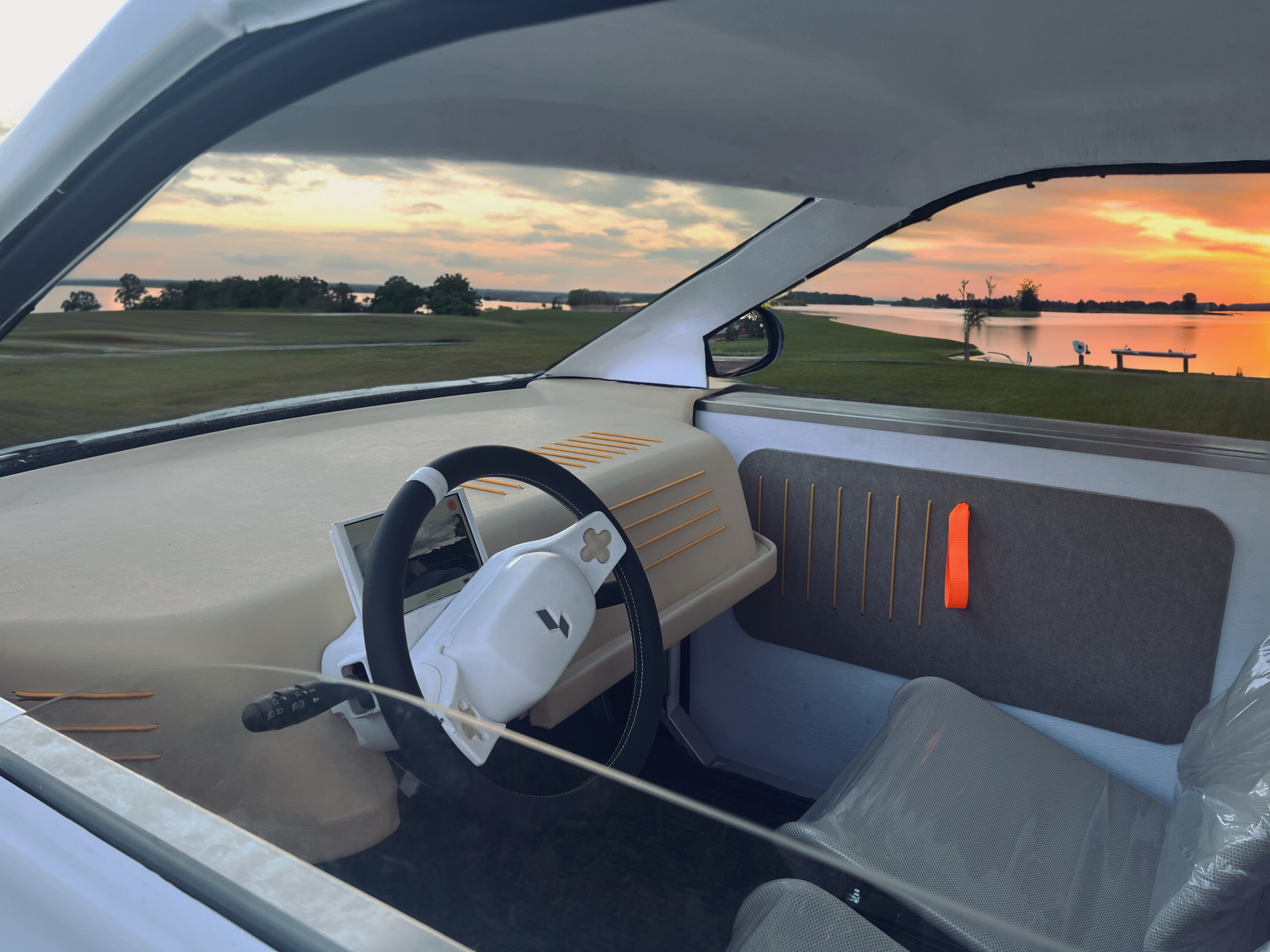 The Luvly O's dashboard is very simple and uncluttered, as an app on a connected smartphone is used to adjust vehicle settings, play back music, and view information such as charge level