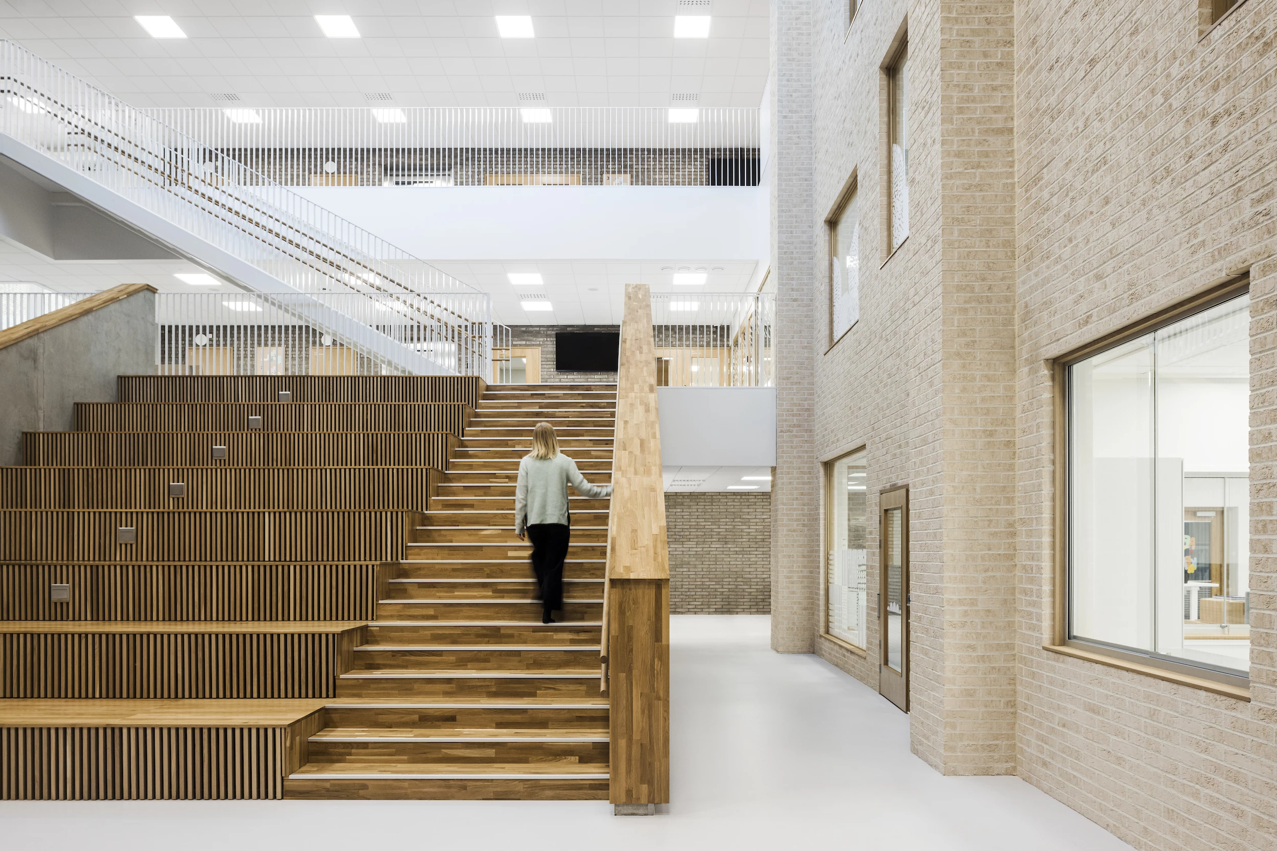 Forssa Multipurpose Centre Akvarelli was designed by Olla Architecture and is located in Finland. The project is conceived as a welcoming learning space that's modeled after a village-like community