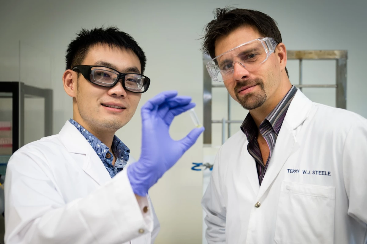 NTU Asst Prof Terry Steele (right) with his researcher Gao Feng have developed a glue that hardens when an electrical voltage is applied