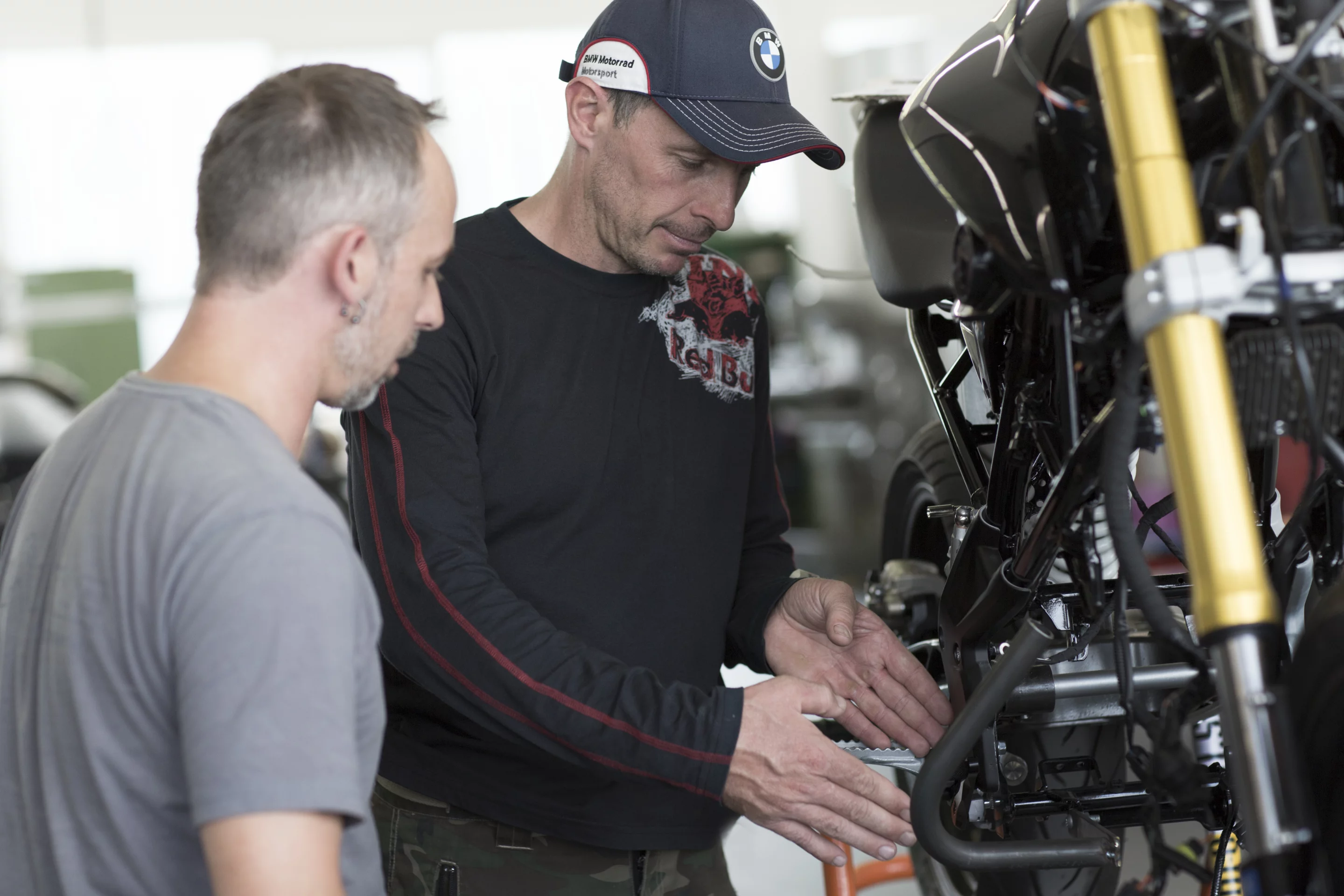 Christian Pfeiffer inspects the BMW Concept Stunt G 310
