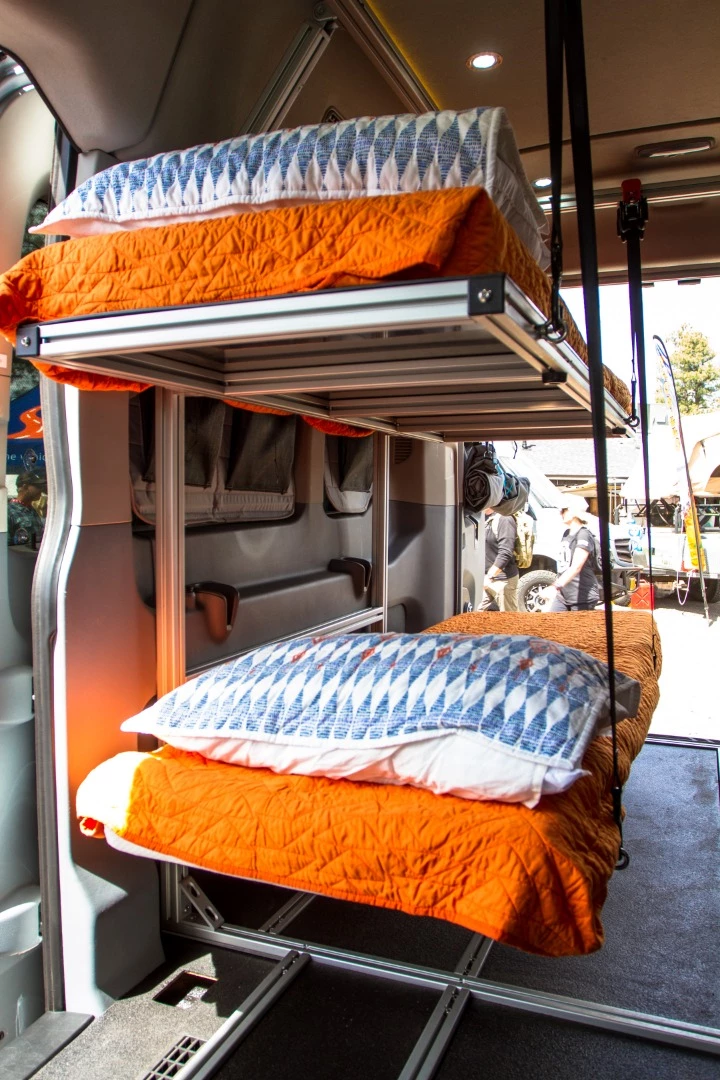 Rather than the double bed more common in camper van conversions, this one sleeps two on a pair of single-person bunks