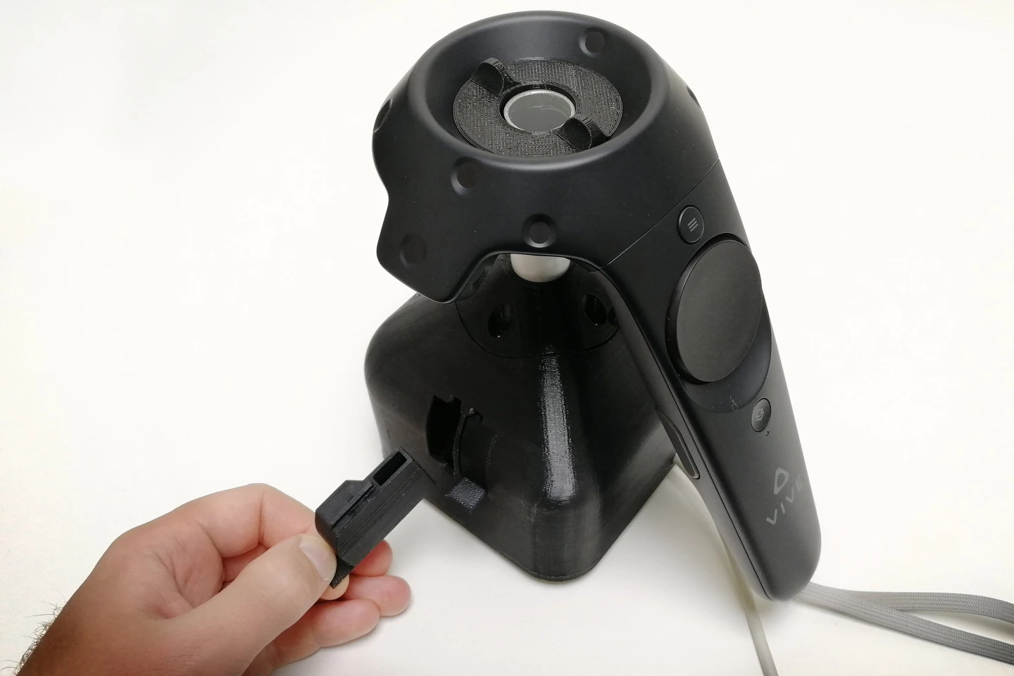The Nosewise Handheld Olfactometer takes advantage of a hole already present in the HTC Vive controller