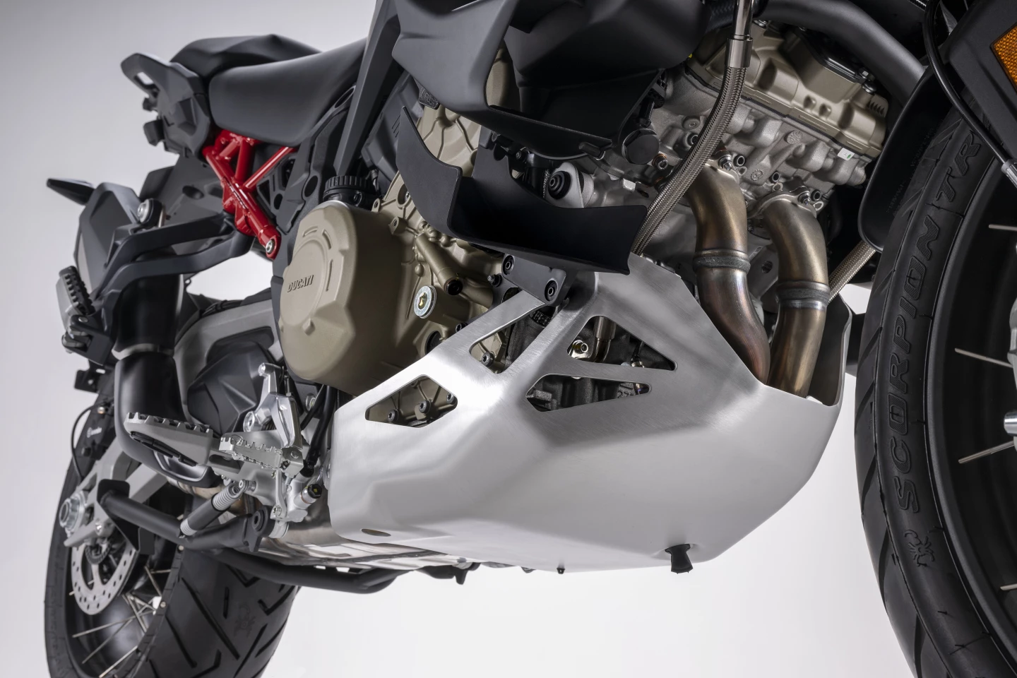 The 170-hp V4 Granturismo engine of the 2023 Ducati Multistrada V4 Rally s protected by a hefty aluminum skid plate