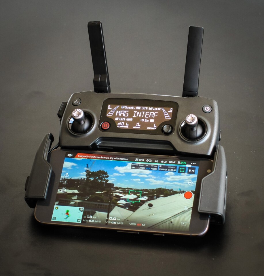 DJI Mavic Pro: a smartphone fits wedged between the two folding lower arms of the remote.