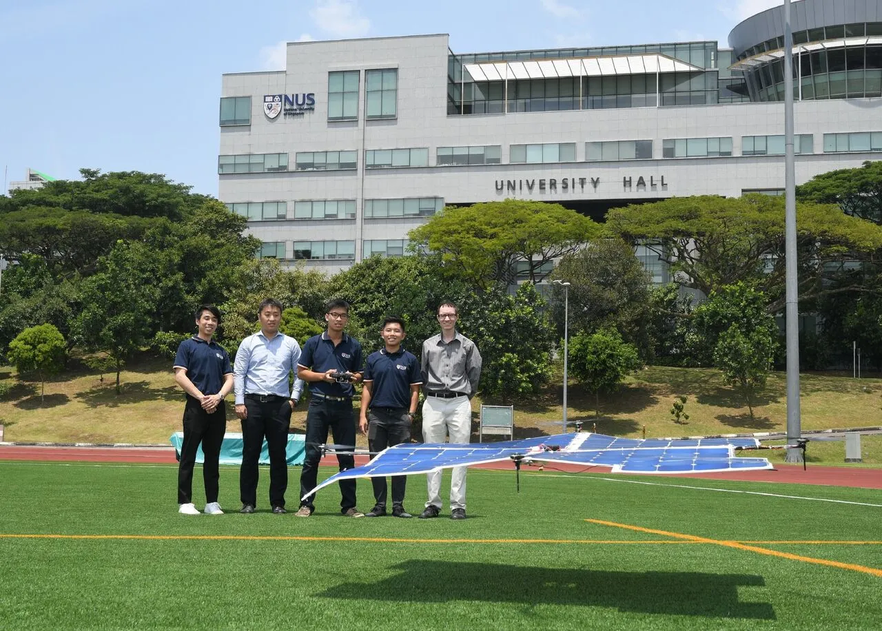 Aaron Danner (right) and his student team, with the solar-powered drone