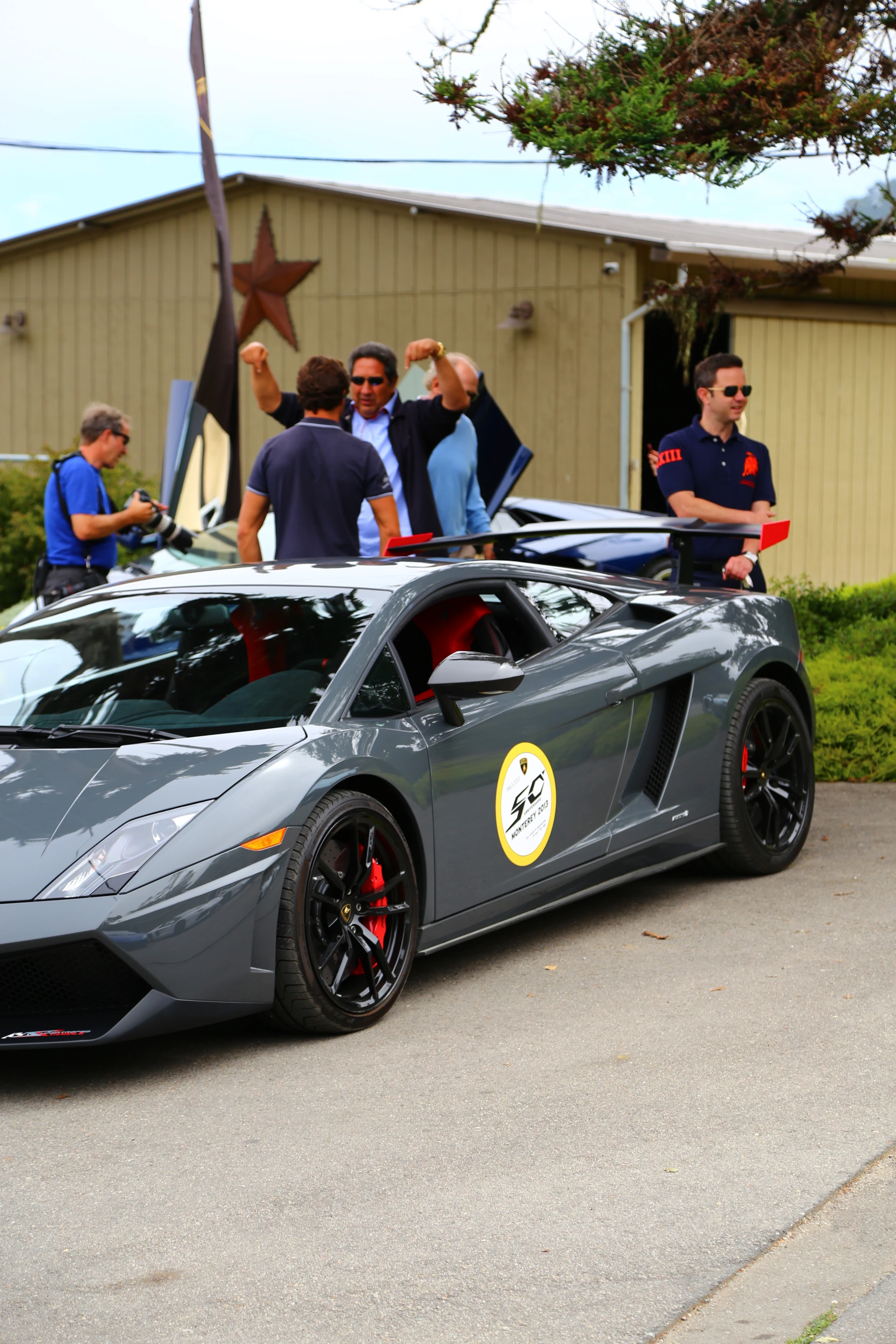 Guests and media wait amongst Gallardos and Aventadors for their turn at the wheel (Photo: Angus MacKenzie/Gizmag.com)