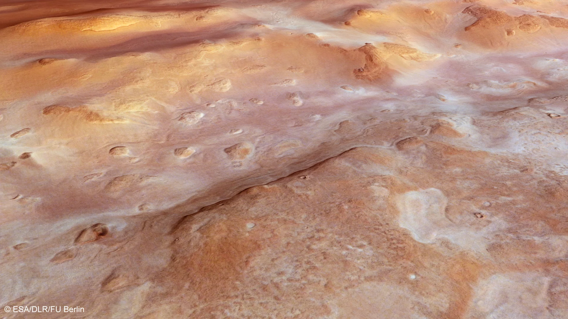 Close-up of a trough-like depression that runs in an east–west direction through Hellas Chaos on the floor of the vast Hellas Basin in the southern hemisphere of Mars (Credit: ESA/DLR/FU Berlin, CC BY-SA 3.0 IGO)