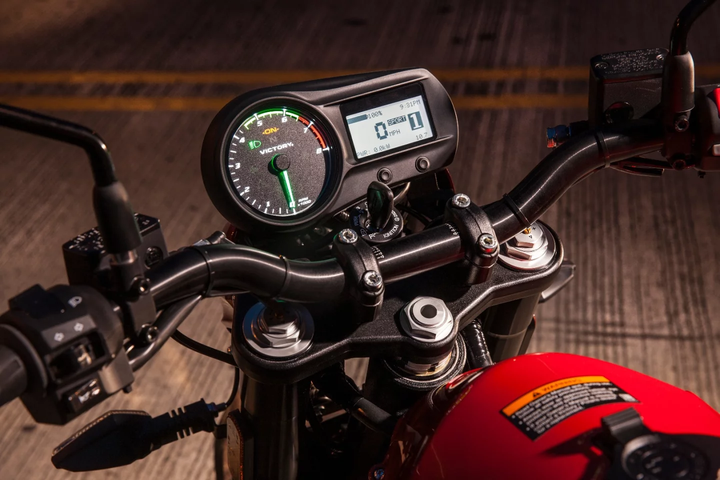 The LCD display hosts a speedometer, tachometer, gear indicator, clock, battery level and estimated range