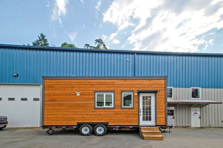 Despite its modest proportions, the Pacific Wren tiny house packs in a home working space and two bedrooms