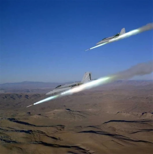 F/A-18s firing simultaneously (not JDAMs)