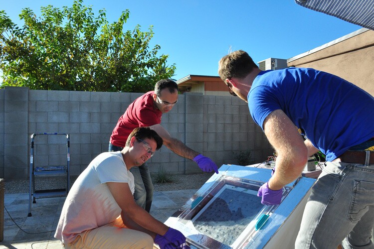 The UC Berkeley researchers test the water-harvesting device prototype in Arizona