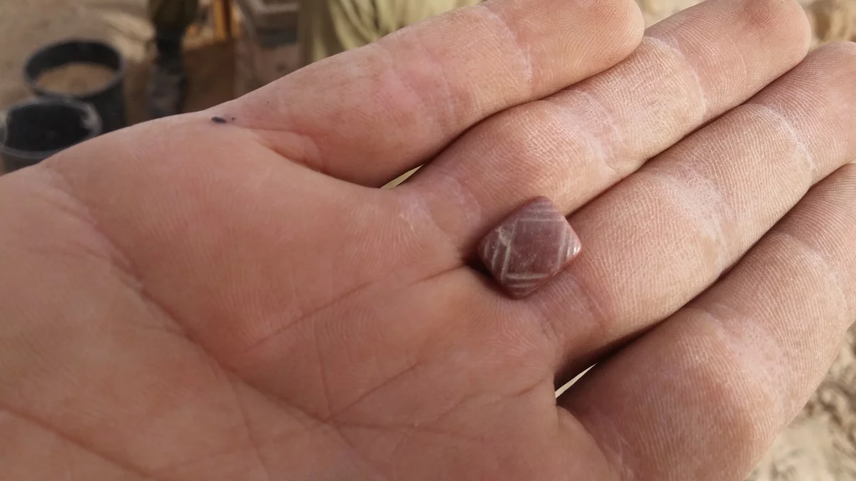 A seal made of carnelian stone, dating from thousands of years earlier, was among the other treasures found in the cave