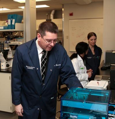 McMaster University Biointerfaces Institute director John Brennan inspects a printable biosensor (Photo: McMaster University)
