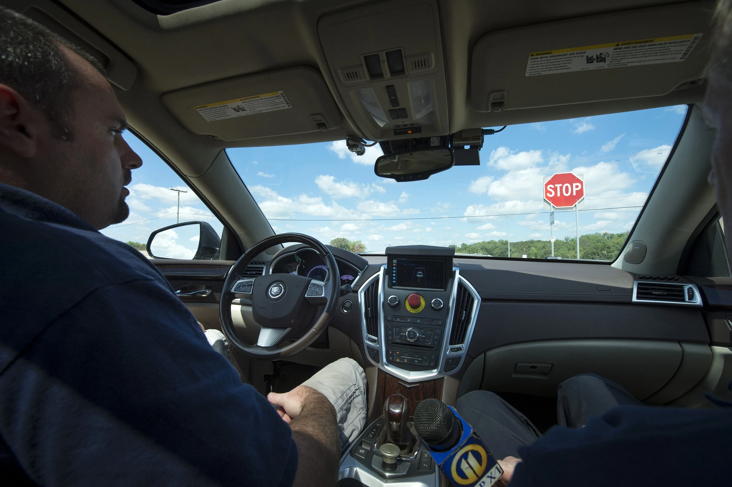 Jarrod Snider, lead engineer of the CMU research team, sits behind the wheel as a safety precaution during testing