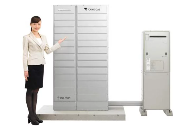 The new Ene-Farm home fuel cell (left) and accompanying hot water unit