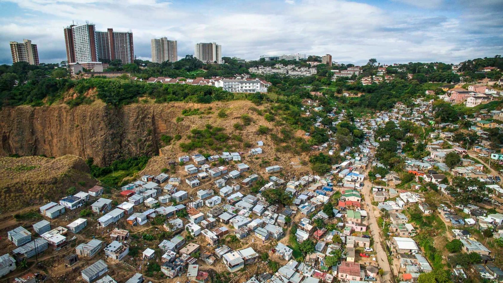 Morningside, one of the wealthiest suburbs in Durban, South Africa, is surrounded by hundreds of tin shacks