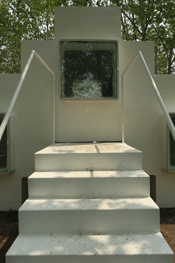 Entrance to the micro-home is via a central staircase