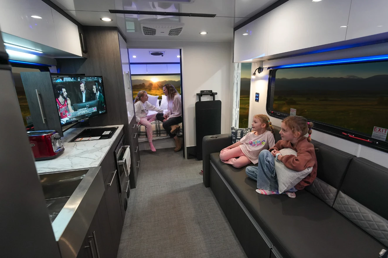 Making use of the secret slide-out TV and sound system