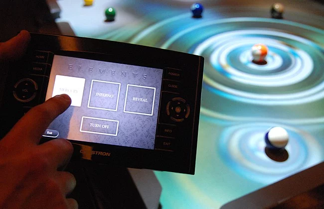 The CueLight Interactive Pool Table System's handheld control unit