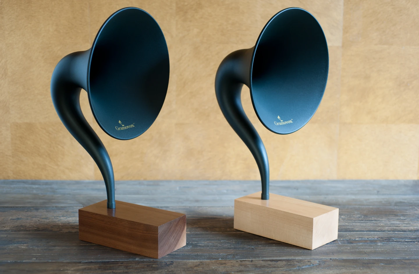 Customers can choose between a walnut (dark) and maple (light) wooden base