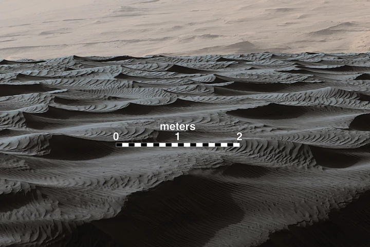 Two sizes of wind-sculpted ripples on Mars sand dune: the larger ripples are roughly three meters apart and of a type not seen on Earth