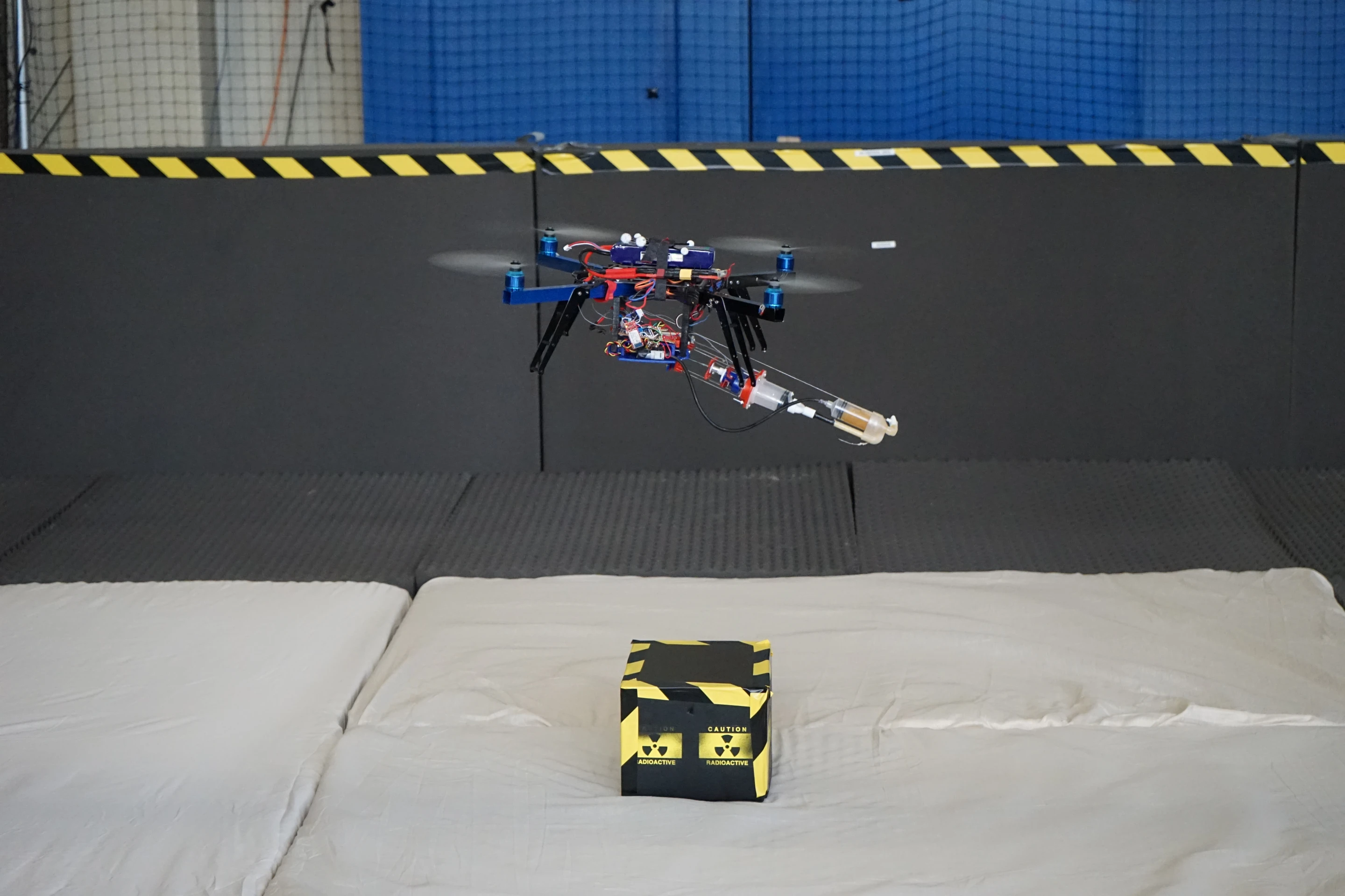 The 3D-printing robotic quadcopter hovers over its target (Photo: Aerial Robotics Lab)