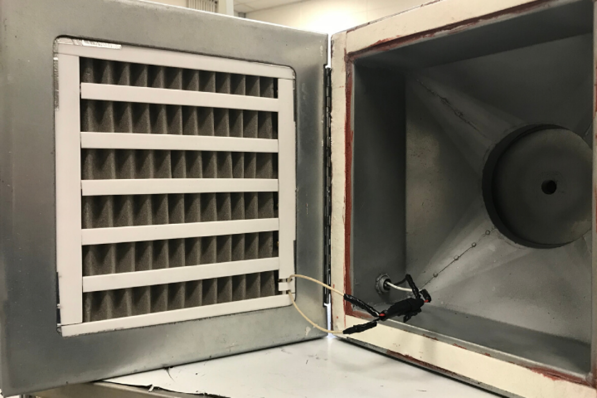 The nickel foam filter (left), installed in an existing HVAC system