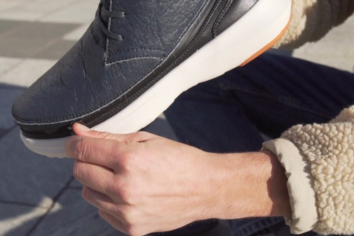 The Chukka-style skin, getting zipped onto one of the soles