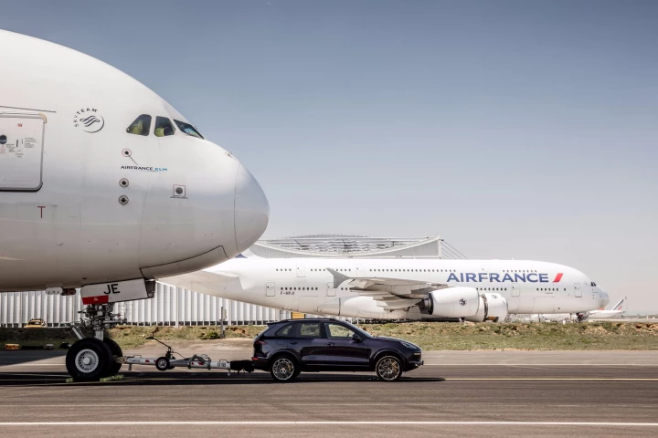 An Air France A380 being pulled by a Porsche Cayenne S Diesel