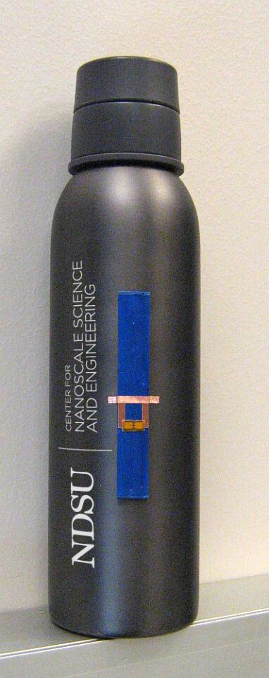 One of the antenna-less RFID tags, on a metal flask
