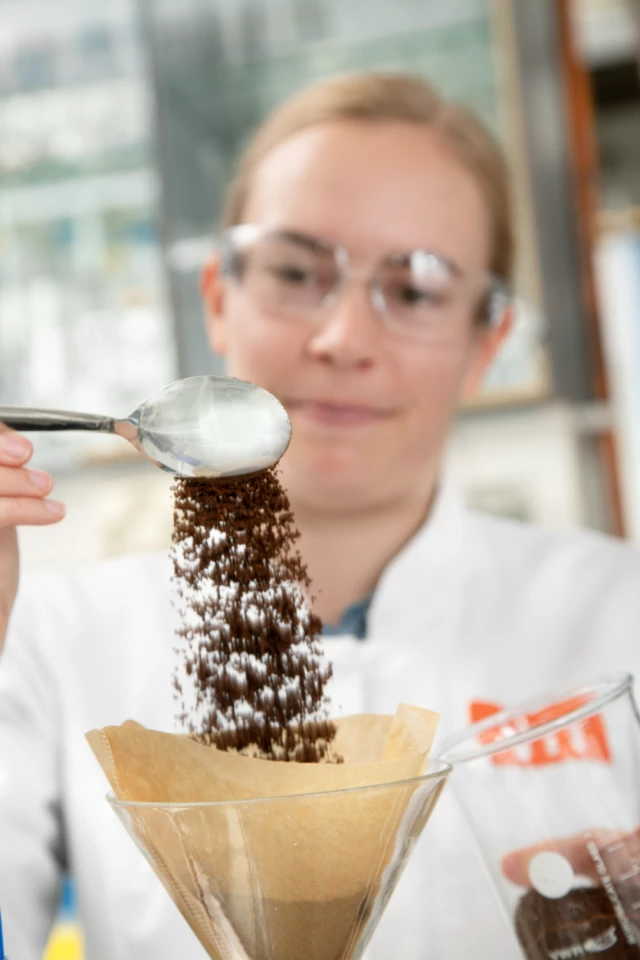 A researcher prepares lab-grown coffee at VTT