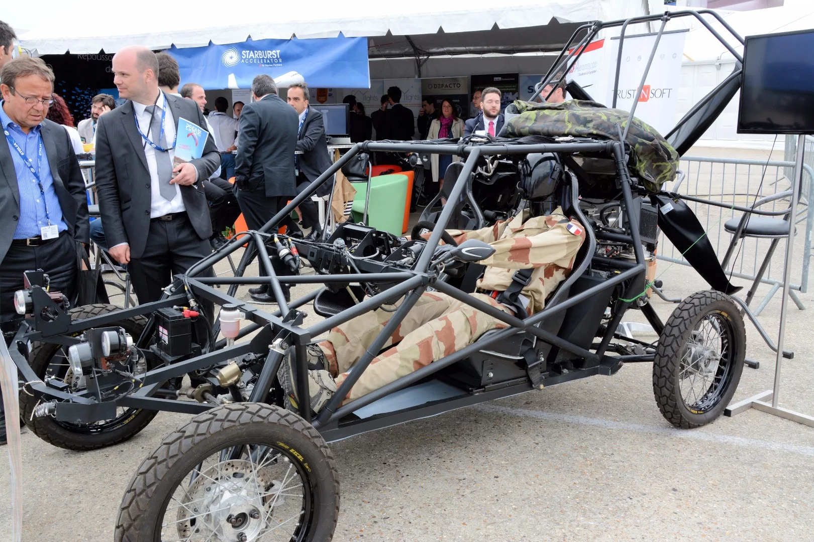 A Vaylon flying car - a dune buggy sporting a large propeller and a paraglider wing
