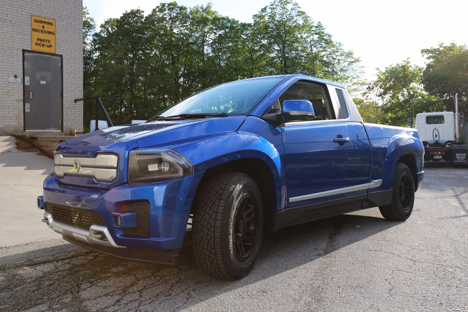 According to the Bison designer, the e-truck speaks a bold design language, punctuated with angular cladding and wedge profiles