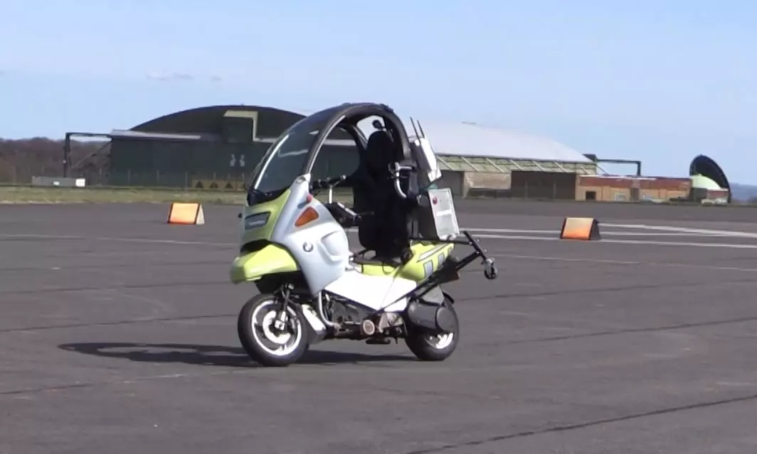 The AB Dynamics self-driving scooter is built on a BMW C1 scooter, fitted with outriggers, GPS gear, self-driving robotics and sensors
