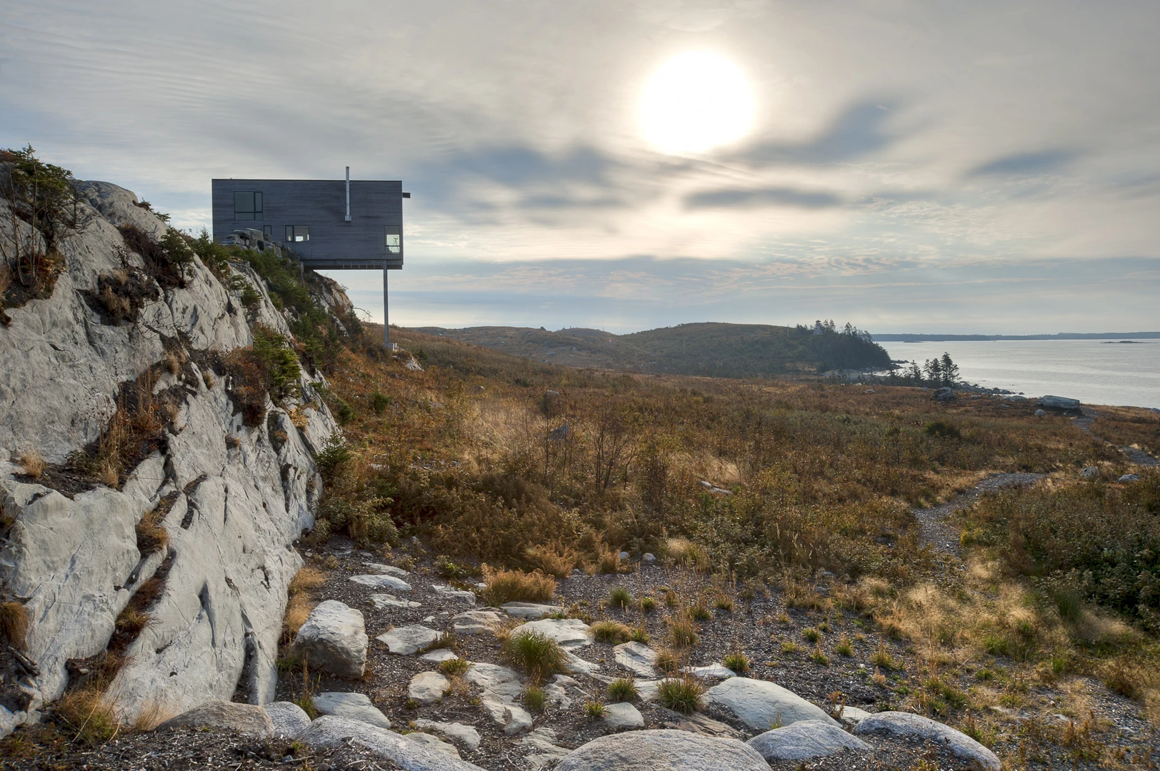 From Mackay Lyons Sweetapple Architects comes this excitingly cantilevered cabin, half hanging off a steep cliff. The cedar-lined structure sits facing the Atlantic coast in Nova Scotia