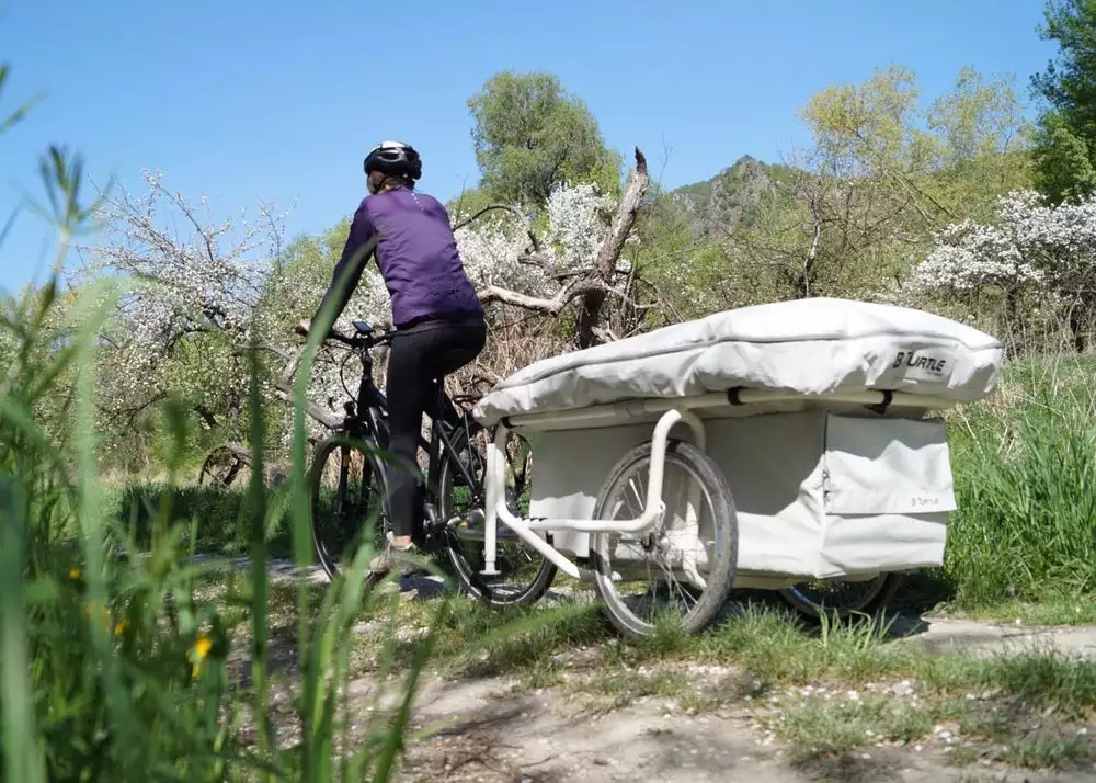The GentleTent B-Turtle compacts down into a bike trailer with added cargo space; the tent can also be removed and the trailer used solely for cargo
