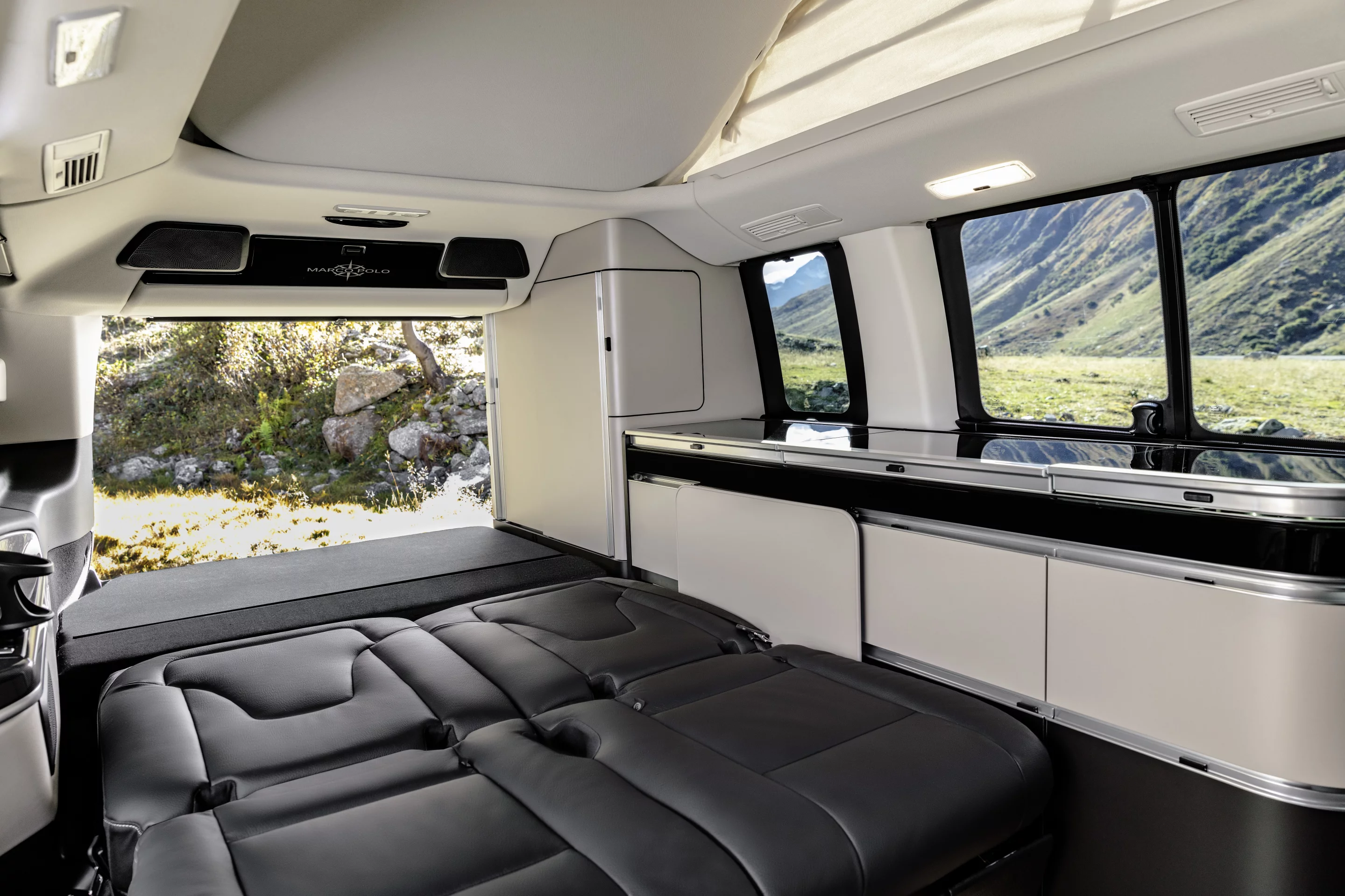 The Marco Polo seats fold into a bed, and a second bed sets up in the roof
