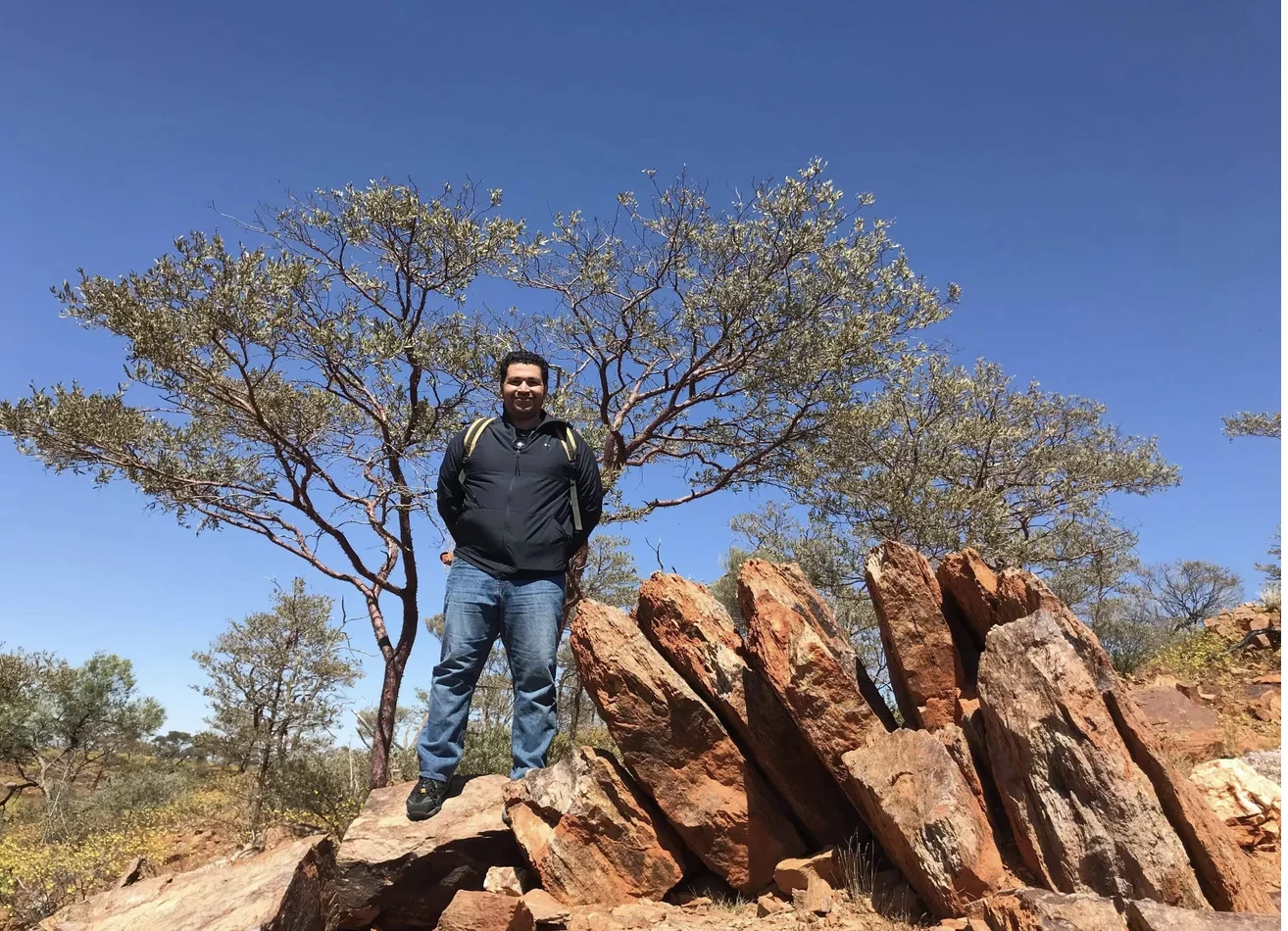 Scientist Hamed Gamaleldien at Jack Hills, a reservoir of these ancient zircon crystals