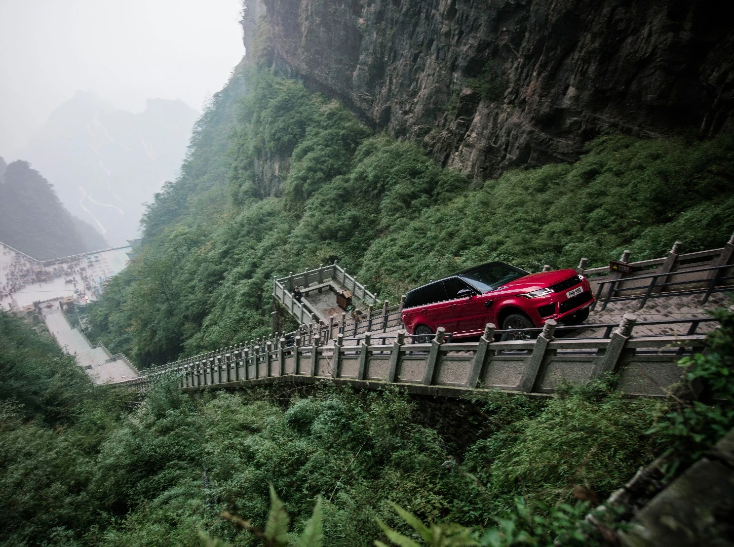 In a stunt unlikely to be repeated, Ho-Pin Tung drives a range rover up the staircase to Heaven's Gate