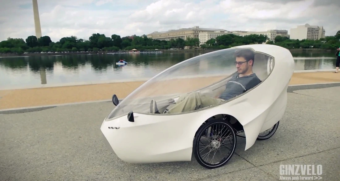 The GinzVelo takes the form of a recumbent tricycle surrounded by a sleek fiberglass/foam core body shell